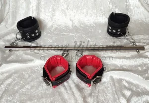 Spreader bar with leather cuffs. Professional Dominatrix offers BDSM sessions in Gothenburg, Stockholm, Sweden. © Queen Viktoria, queenviktoriax.com